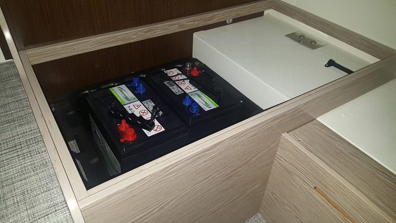 Dual Battery Compartment in Dinette in Cirrus 920 Truck Camper