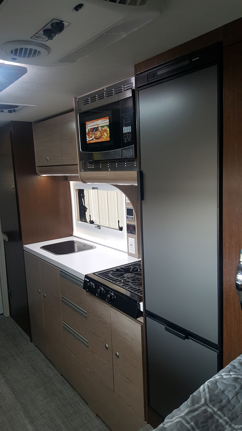 One Cabinet Over Sink and Two Below in Cirrus 920 Truck Camper